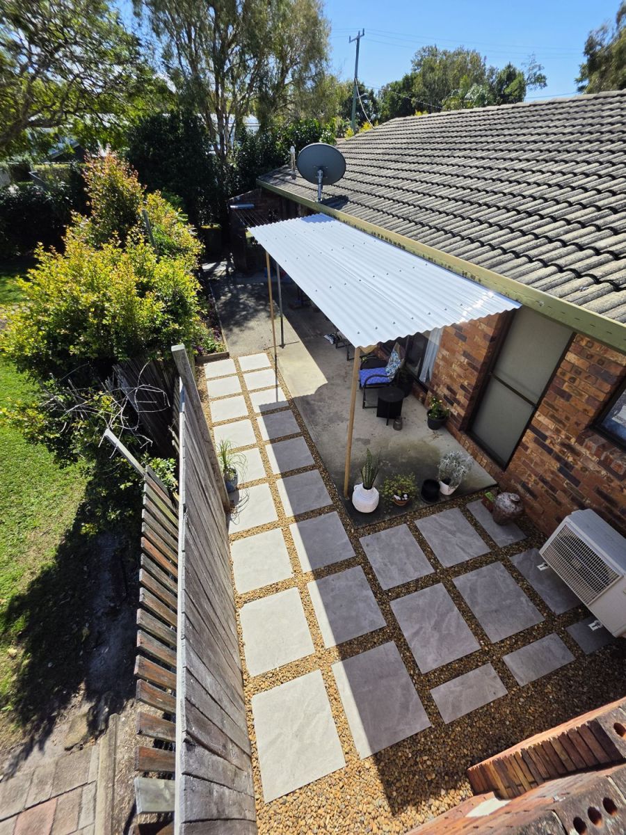 The same spot from above with new large pavers set in gravel