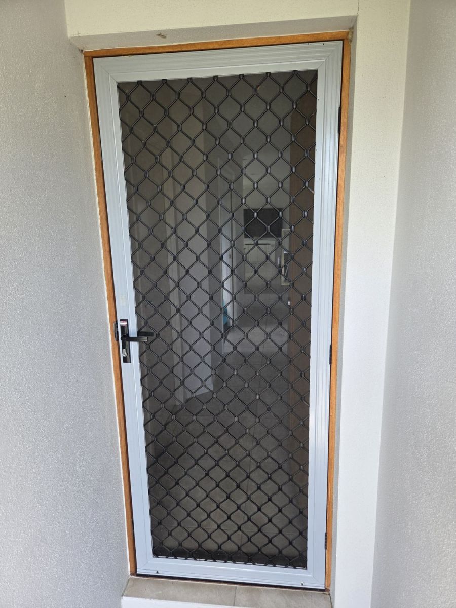 Security screen door fitted to a front entry
